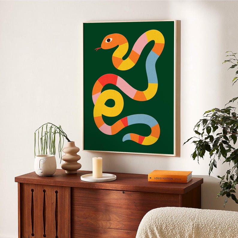 May include: An abstract illustration of a snake on a dark green background. The snake is made up of various shapes and colours, including yellow, orange, red, pink, and blue.