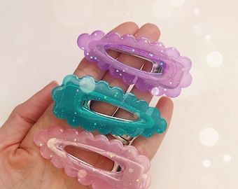 Pasador de pelo festoneado en tonos joya