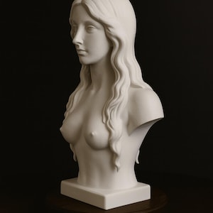 May include: A white bust sculpture of a woman with long, wavy hair. The sculpture is a classical style, with the woman's shoulders and chest visible. The bust is mounted on a square base and a round wooden stand.