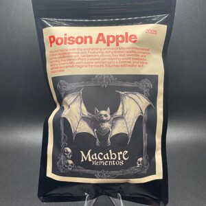 May include: A black pouch with a white label that says "Poison Apple 2025" and features a black bat illustration with a white background. The label also says "Macabre Mementos".