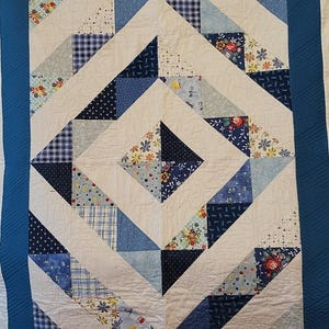Blue and White with a diamond design lap quilt