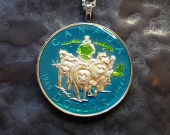 Canada - Dog Sled Team Coin Pendant. Hand Painted by Ann Nolen. Coin size Medium, about 1-1/4 inch. Coin date 1994.