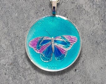 Hand Painted Congo-Africa Coin: Butterfly Pendant. 1 inch coin dated 2002.