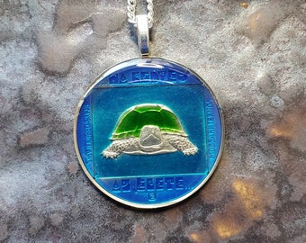 Coin from Hungary, hand painted by Ann Nolen. European Pond Turtle. Coin size medium, about 1-1/4 inch. Coin date 1985.