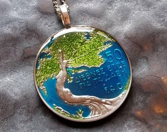 Cyprus - Int'l Year of the Forest Coin pendant. Hand Painted by Ann Nolen. Tree, Diana. Coin size large, about 1-1/2 inch. Coin date 1985.