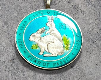 Hand Painted Somalia coin.  Year of the Rabbit Pendant. 1-1/2 inch coin dated 1999.