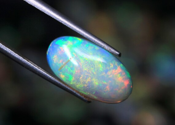 AAA Ethiopian Welo Opal Cabochon: 3.05 CT Oval Gemstone, October Birthstone