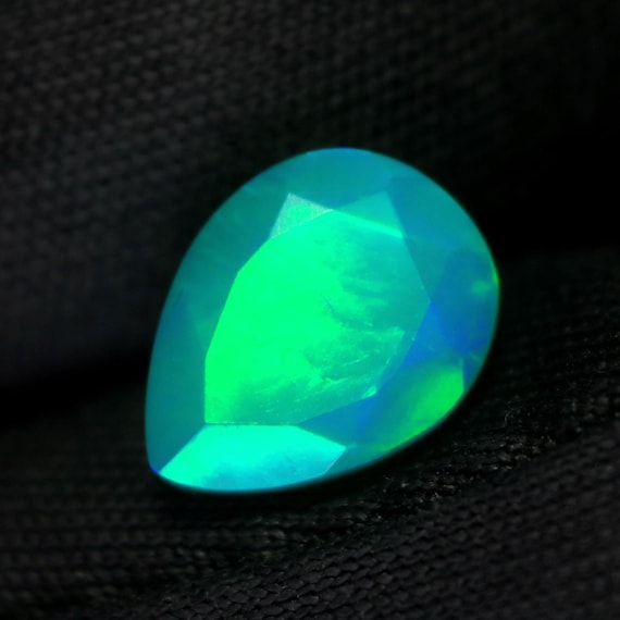 Faceted Welo Opal Gemstone, 1.20 CT Pear Cut Ethiopian Opal
