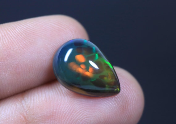 AAA+ Unique Black Opal Pear Cabochon, Rainbow Fire Ethiopian Honeycomb Opal Gemstone (5.70 Carat)