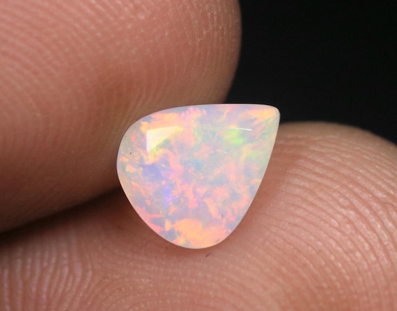 Faceted Ethiopian Welo Opal Gemstone: 0.70 CT Pear Cut AAA Grade