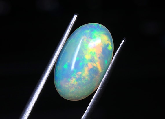 Welo Fire Opal Cabochon: 3.10 CT Hand Polished Oval Ethiopian Gemstone
