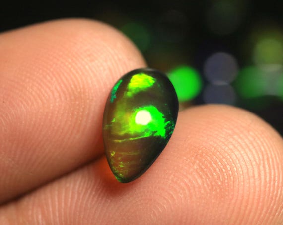 Ethiopian Welo Opal Loose Gemstone: 1.55 Carat Pear Black Opal Cabochon For Jewelry Stone