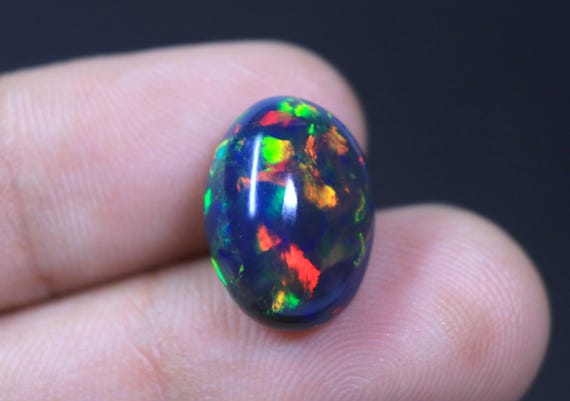 AAA Grade Ethiopian Welo Black Opal Oval Cabochon, 7.30 Carat Rainbow Opal Loose Gemstone