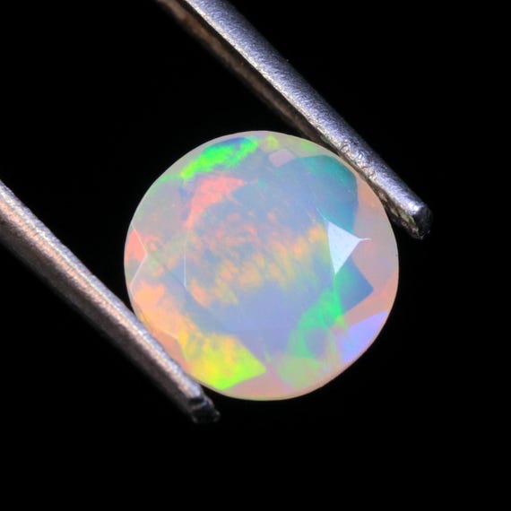Ethiopian Welo Opal Gemstone: AAA Faceted Round Fire Opal, 1.10 CT (7.50x3.60 MM)
