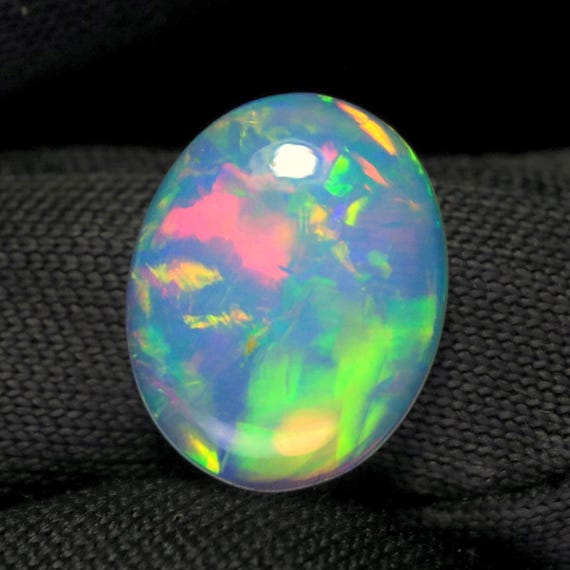 Ethiopian Opal Cabochon: 1.10 CT Rainbow Fire Gemstone, 10x8x3 MM