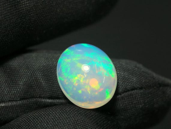 Ethiopian Opal Cabochon: 6.55 CT Oval Fire Opal Gemstone