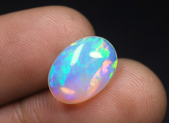 Ethiopian Welo Opal Cabochon: 2.40 CT Oval Multi Fire Gemstone, 14x10x4 MM