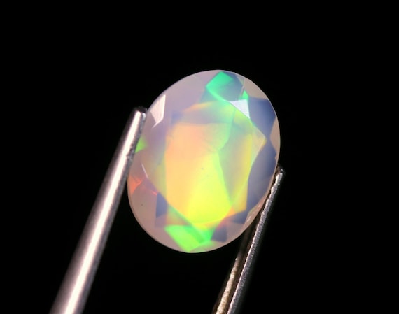 AAA Ethiopian Opal Gemstone: 2.00 CT Oval Faceted Welo Opal