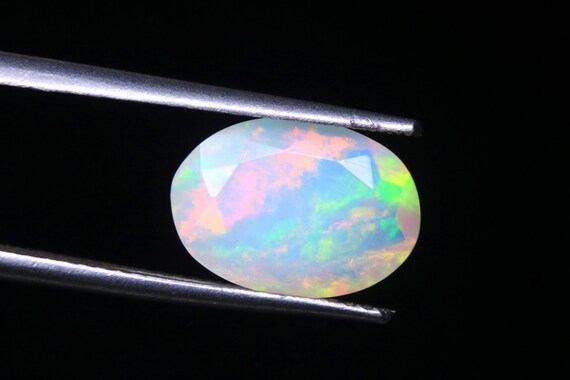 Faceted Ethiopian Welo Opal Gemstone: Oval Galaxy Fire Opal, 1.60 CT
