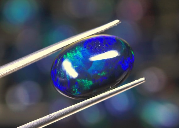 3.75 CT Ethiopian Black Opal Cabochon: Natural Fire Gemstone
