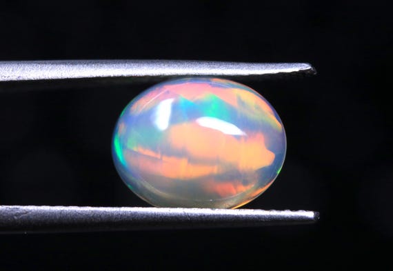 Ethiopian Opal Cabochon: 1.55 CT Oval Multi Fire Gemstone (10x8x4 MM)
