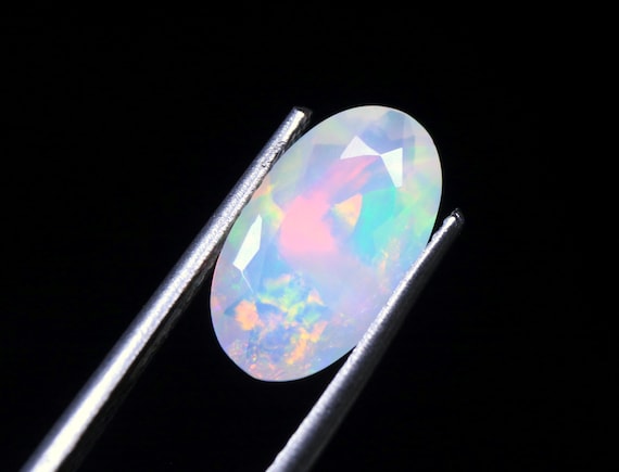 Faceted Ethiopian Welo Opal Gemstone: Oval Galaxy Fire Opal, 1.45 CT