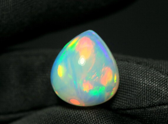 Ethiopian Welo Pear Opal Gemstone: 6.65 CT AAA Multi Flash Cabochon