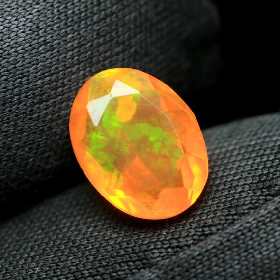 Oval Orange Ethiopian Opal Gemstone: Rare Fire Smoked Faceted Stone (9.30x7x4.50 MM)