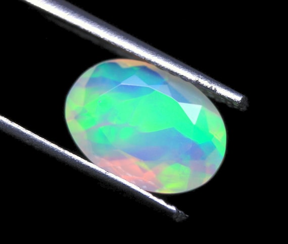 Ethiopian Opal Gemstone: 1.25 CT Oval Faceted Cut Galaxy Fire Opal Jewelry Stone