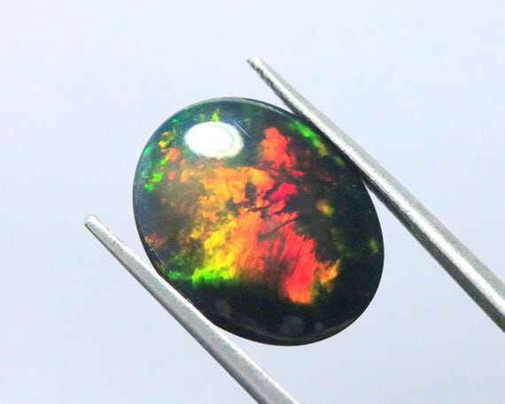 Ethiopian Welo Opal Cabochon: 5.35 CT Oval Black Gemstone, AAA Grade