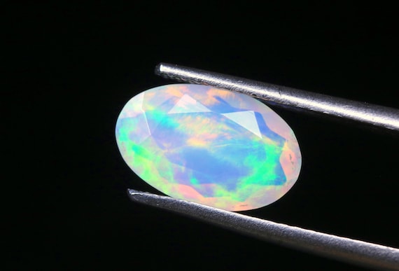Faceted Ethiopian Welo Opal Gemstone: Oval Galaxy Fire Opal, 1.15 CT