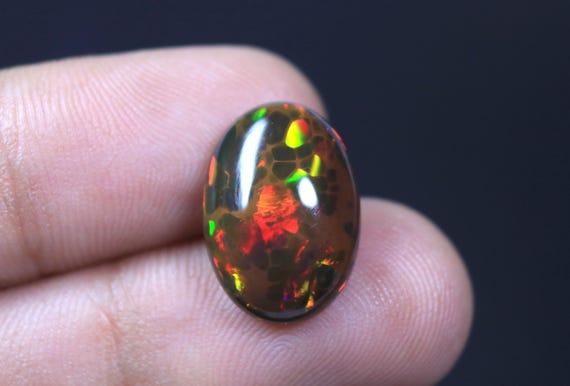 AAA+ Unique Black Opal Oval Cabochon, Rainbow Fire Ethiopian Honeycomb Opal Gemstone (5.40 Carat)
