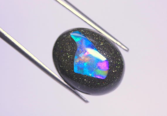 Ethiopian Black Opal Cabochon: 6.70 Carat Rainbow Fire Oval Boulder Opal Gemstone