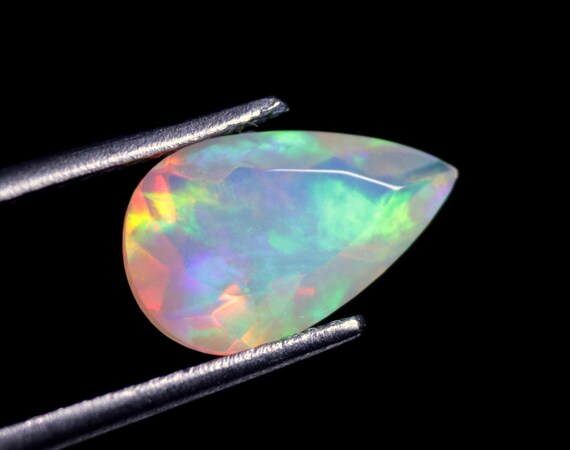 Faceted Welo Opal Gemstone: 1.30 CT Pear Shape, Rainbow Fire