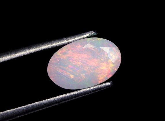 Faceted Ethiopian Opal Gemstone: 1.40 CT Oval Welo Opal, 9.50x6x5 MM