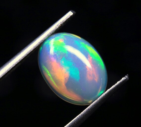 Ethiopian Opal Cabochon: 1.25 CT Multi Fire Gemstone for Jewelry (10.30x7.70x3.30 MM)