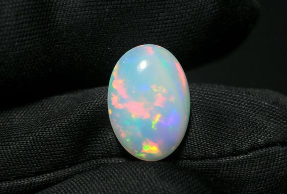 Ethiopian Opal Gemstone: 3.05 CT Oval Cabochon, Multi-Fire Crystal