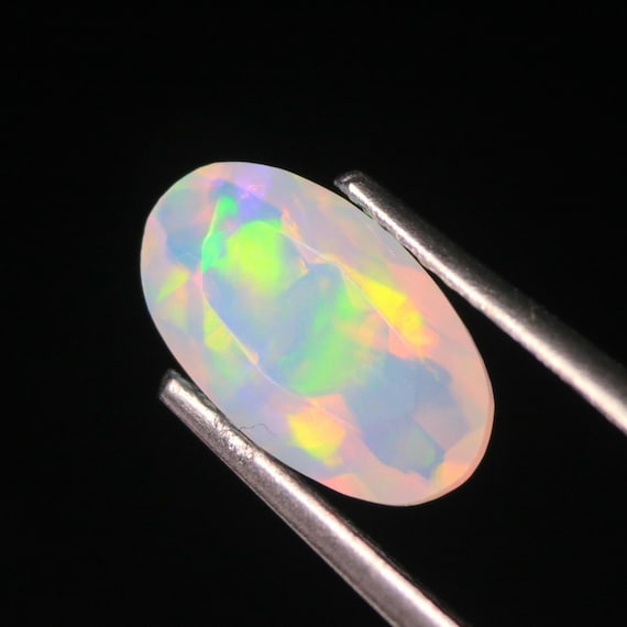 Ethiopian Welo Opal Gemstone: 1.10 CT Faceted Oval, Colorful Fire