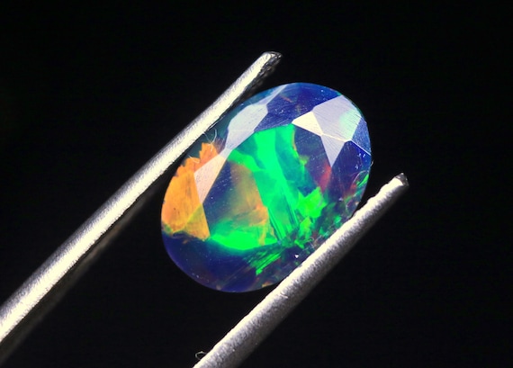 Rainbow Welo Opal Gemstone: 1.50 CT Faceted Oval Ethiopian Black Opal Jewelry Stone