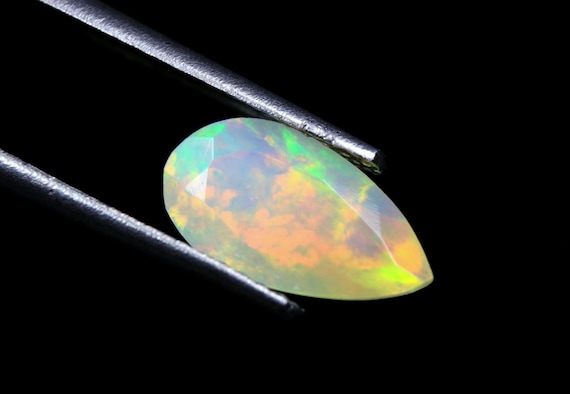 Natural Ethiopian Opal Pear Gemstone: Galaxy Fire Faceted Stone (1.00 CT)