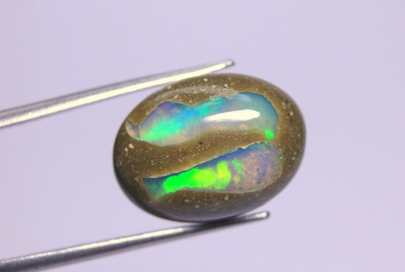 Natural Ethiopian Opal Cabochon: 8.30 Carat Rainbow Fire Oval Boulder Opal Gemstone