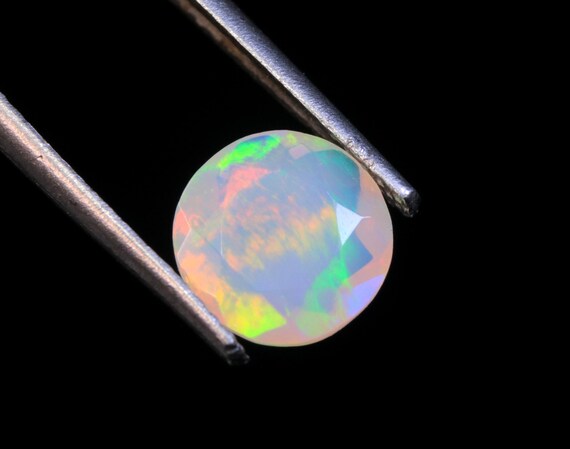 Ethiopian Welo Opal Gemstone: AAA Faceted Round Fire Opal, 1.10 CT (7.50x3.60 MM)