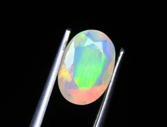 Faceted Ethiopian Welo Opal Gemstone: Oval Galaxy Fire Opal, 1.85 CT