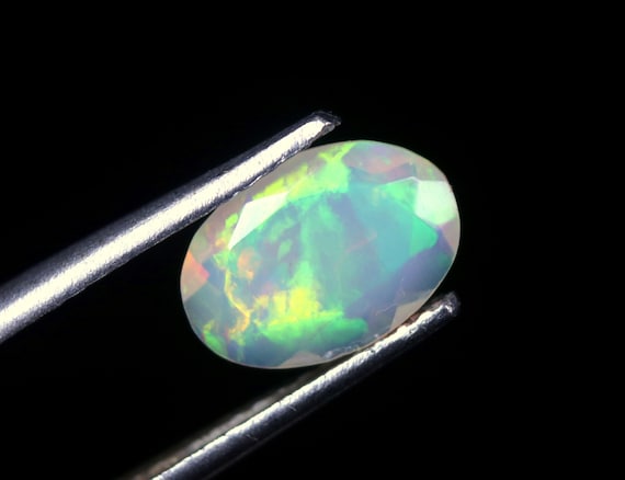Faceted Ethiopian Welo Opal Gemstone: 0.65 CT Oval Cut Stone