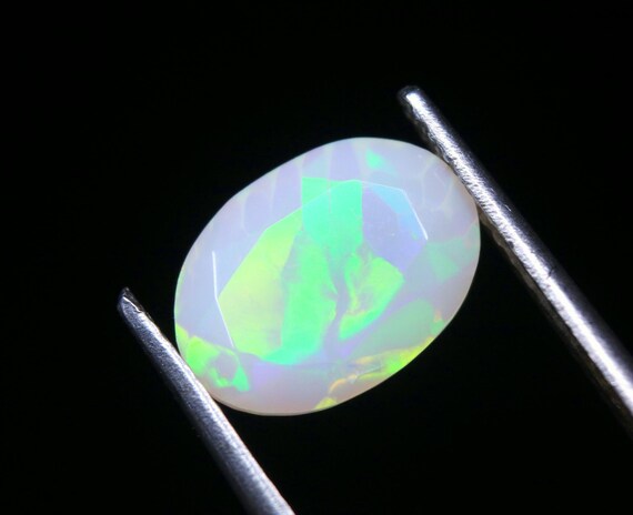 Ethiopian Welo Opal Gemstone: 1.75 CT Oval Faceted Galaxy Fire Opal