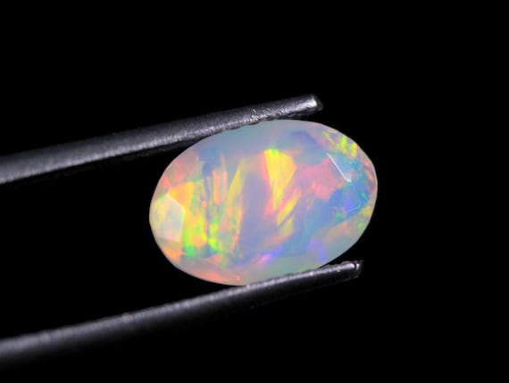 Ethiopian Welo Opal Gemstone: 1 CT Oval Faceted October Birthstone