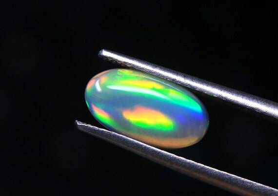 Welo Opal Gemstone: 1.30 CT Multi Flashy Cabochon (10.70x5.80x3.30 MM)