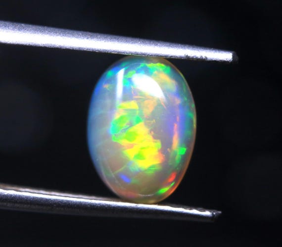 Welo Fire Opal Cabochon: Ethiopian Rainbow Gemstone for Jewelry (9x6.60x3.40 MM)