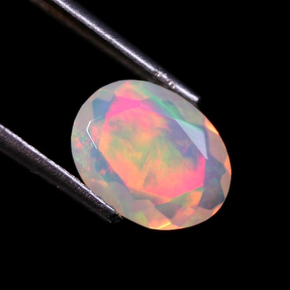 Faceted Ethiopian Welo Opal Gemstone: 1.10 CT Oval White Opal Cut Stone For Jewelry