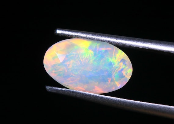 Ethiopian Welo Opal Gemstone: 1.15 CT Oval Faceted Galaxy Fire Opal
